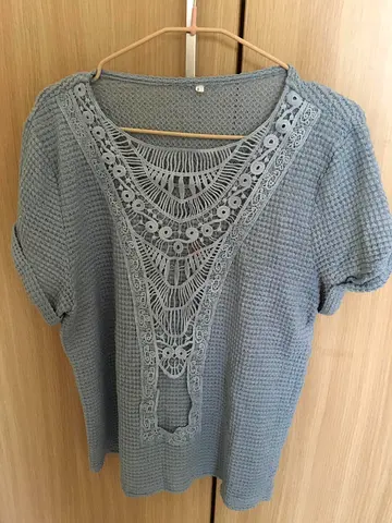 Light blue womens crochet detail short-sleeve top, size approx large