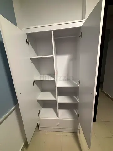 White storage cabinet with multiple shelves 180*80.