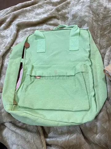 Light Green Fabric Backpack with Front Pocket