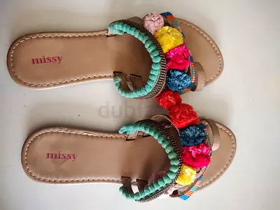 Womens flat slip-on sandals with colorful pompom detail, size 38