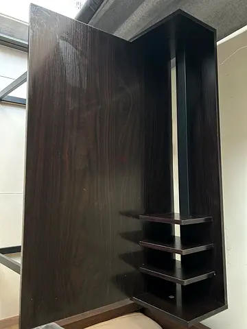 Dark wood study/computer desk with built-in shelves and a chair