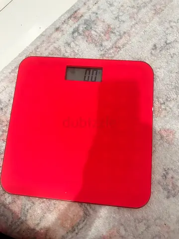 Red digital bathroom scale - working