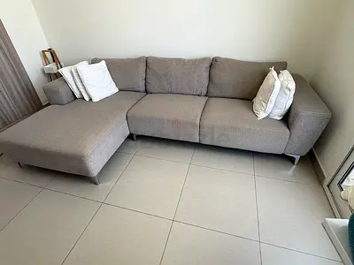 Light grey L-shaped 3-seater sofa with chaise