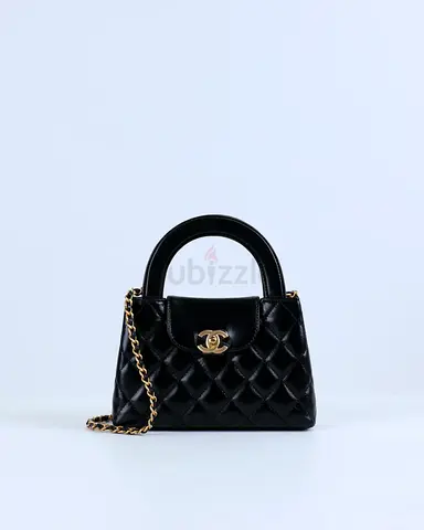 Authentic Chanel Kelly Bag Shiny Aged Calfskin  Gold-Tone Metal in Black Medium size
