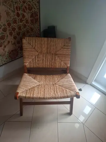 A Pair of Woven Rattan and Wood Lounge Chairs
