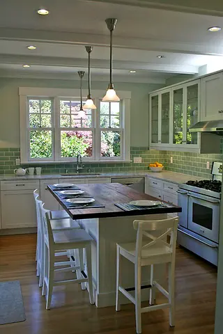 White Shaker Kitchen with Central Wooden Island and storage
