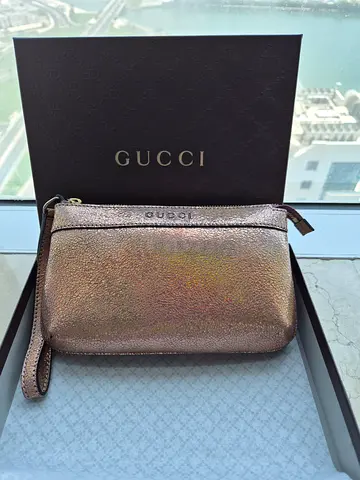 Gucci Authentic brand new metallic wristlet pouch with original box