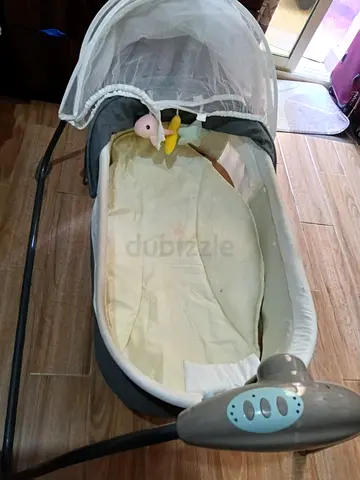 Baby bassinet with canopy and mobile - gently used
