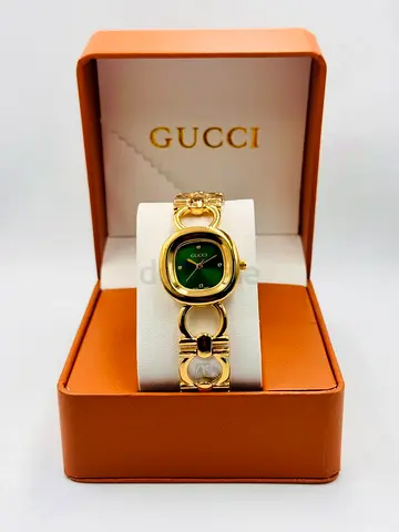 Gucci womens gold-tone bracelet watch with green dial - boxed