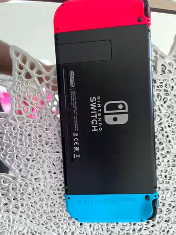 Nintendo Switch console with Neon Red/Blue Joy-Cons - Good condition
