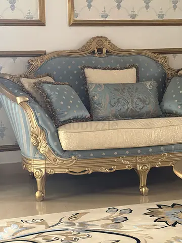 Antique-style blue and gold 2-seater loveseat with cushions and tables