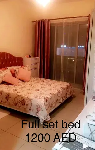 Full bedroom set with bed, dresser and curtains - 1200 AED