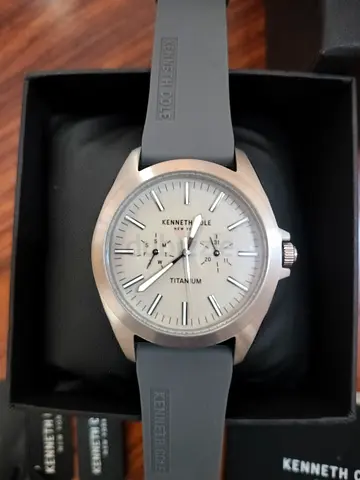 Brand New Kenneth Cole Men’s Titanium Watch, mega quartz with Grey Silicone Strap. With warranty