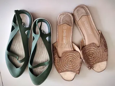 Pair of womens shoes — embellished gold slides and green flats,