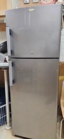 Silver Double-Door Refrigerator-Works Well. Price is negotiable. Needs to move out ASAP