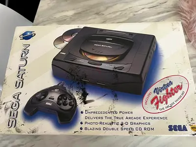 Sega Saturn console with controller — boxed, includes Virtua Fighter demo