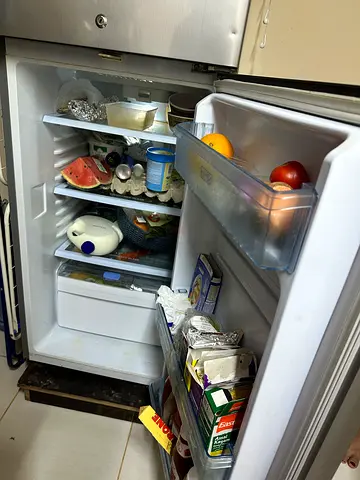 Compact double-door refrigerator in working condition