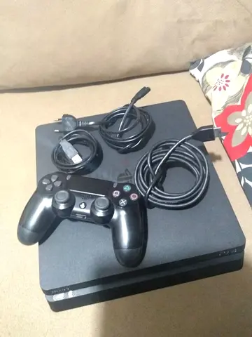 PlayStation 4 Slim with DualShock controller and cables - Working condition