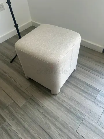 Light grey fabric ottoman / footstool - compact cube