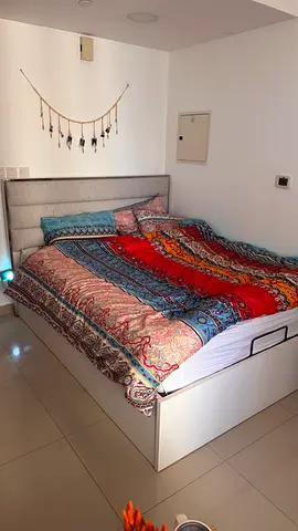 White storage bed frame with upholstered headboard - Queen