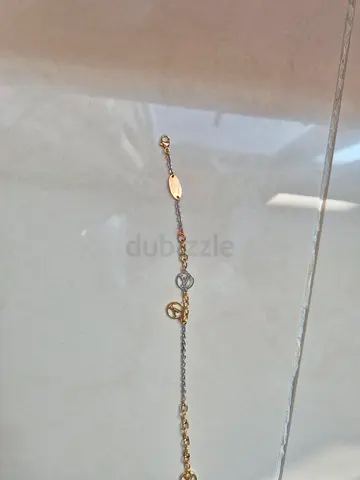Authentic Louis Vuitton - Delicate two-tone chain bracelet with small charms