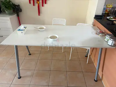 Simple white rectangular dining/work table with metal legs - good condition