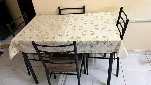 4-seater metal dining table with chairs (used) - compact set