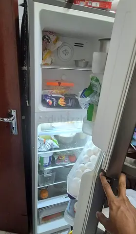 Small single-door refrigerator with built-in freezer - used, working