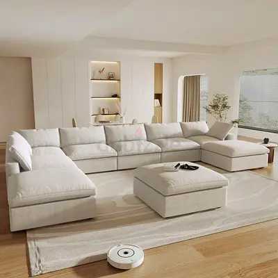 Large L-shaped Cream Fabric Sofa with Ottoman - Good Condition