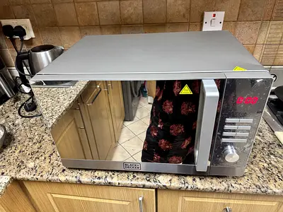 Black  Decker Stainless Steel Microwave - Good Working Condition