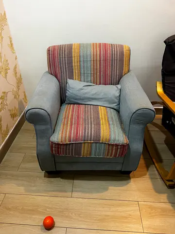 Comfortable Armchair with Striped Cushions - Good Condition