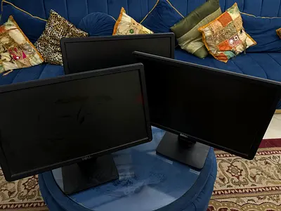 Set of three Dell monitors