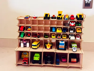 Wooden display rack with 30+ toy cars and trucks - good condition