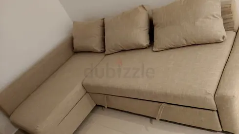 Beige L-shaped Sofa Bed with Storage - Good Condition