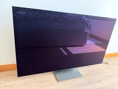 55-inch Samsung TV in decent  Condition with stand.