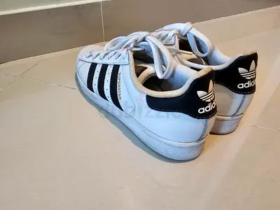 Adidas Superstar - White Sneakers with Gold and Black Stripes