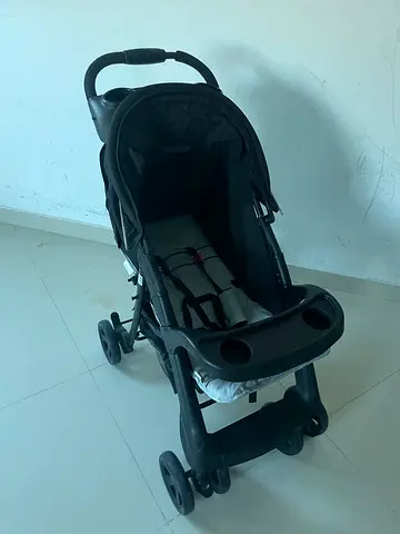 Used black standard baby stroller with snack tray