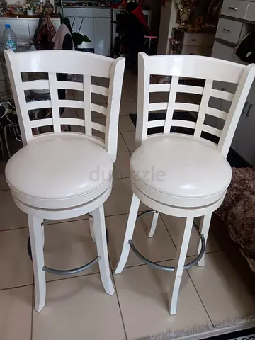 Pair of white revolving high chairs