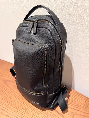 TUMI Harrison Black leather backpack - fits 14” laptop with protection padding. Excellent condition
