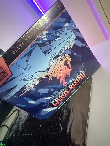 Pokémon TCG Elite Trainer Box — Chaos Rising artwork (sealed sleeve/mat)