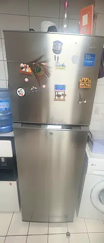 My stainless steel double-door refrigerator in good working condition