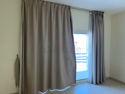 Light-blocking beige curtains with track — used, good condition