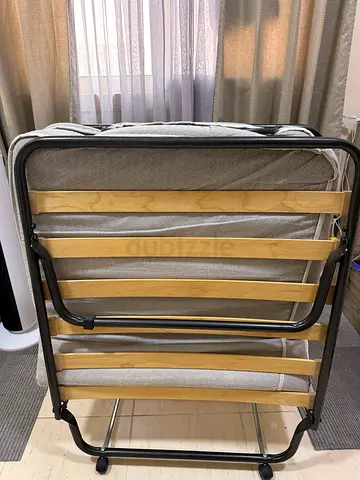 Folding bed with mattress