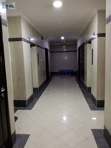 For annual rent: a two-bedroom apartment with a living room in Al Nuaimiya 1 area, Ajman, in a prime and vibrant location next to Al Hikma School and