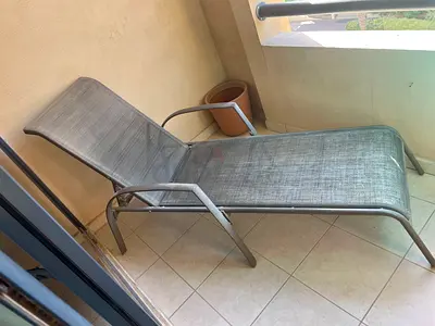 Outdoor sun lounger / chaise longue - metal frame, sling seat. No marks/wear and tear