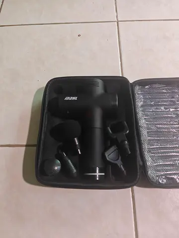 Compact massage gun with multiple heads — light use