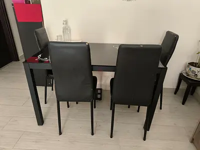 Black 4-Seater Dining Table with Faux Leather Chairs