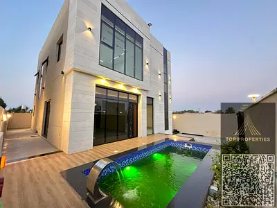 Luxury villa for sale with private pool in Al Helio 2, Ajman. Includes registration and ownership fees. 4 master bedrooms with built-in wardrobes, maj