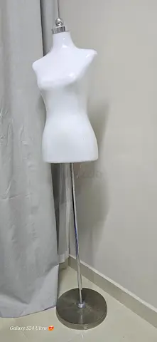 Tall white sculptural floor lamp with metal base