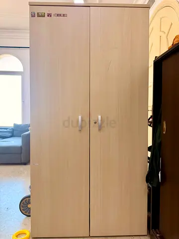 Two-door wooden wardrobe - light oak finish, good condition